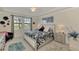 Spacious main bedroom with king-size bed and ample natural light at 23210 Banbury Way # 101, Venice, FL 34293