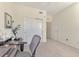 Home office with desk, chair, and built-in closet at 23210 Banbury Way # 101, Venice, FL 34293