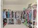 Large walk-in closet with ample shelving and hanging space at 23210 Banbury Way # 101, Venice, FL 34293