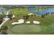 Aerial view of golf course with sand traps and water features at 23402 Copperleaf Dr, Venice, FL 34293