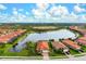 Aerial view showing home's location and lakefront setting at 23402 Copperleaf Dr, Venice, FL 34293