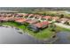 Aerial view showcasing home's location in community near lake at 23402 Copperleaf Dr, Venice, FL 34293