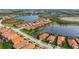 Aerial view showcasing home's location near a lake at 23402 Copperleaf Dr, Venice, FL 34293
