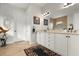 Elegant bathroom with double vanity, large mirror, and neutral tones at 23402 Copperleaf Dr, Venice, FL 34293