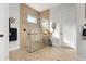 Spa-like bathroom with large walk-in shower and neutral tile at 23402 Copperleaf Dr, Venice, FL 34293