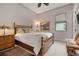 Cozy bedroom with bamboo bed frame and neutral decor at 23402 Copperleaf Dr, Venice, FL 34293