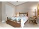 Simple bedroom with bamboo bed frame and neutral decor at 23402 Copperleaf Dr, Venice, FL 34293