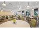 Elegant clubhouse dining area with tables and chairs at 23402 Copperleaf Dr, Venice, FL 34293