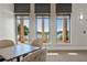 Indoor view of the clubhouse with relaxing seating and golf course view at 23402 Copperleaf Dr, Venice, FL 34293
