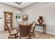 Elegant dining room with glass table and wicker chairs at 23402 Copperleaf Dr, Venice, FL 34293