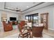 Spacious dining room with glass table and wicker chairs at 23402 Copperleaf Dr, Venice, FL 34293