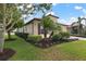One-story home with landscaped yard and lake view at 23402 Copperleaf Dr, Venice, FL 34293