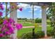 View of golf course from under a pergola at 23402 Copperleaf Dr, Venice, FL 34293