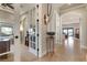 Open hallway with views into an office and living area at 23402 Copperleaf Dr, Venice, FL 34293