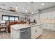 Spacious kitchen with island, stainless steel appliances, and white cabinets at 23402 Copperleaf Dr, Venice, FL 34293