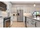 Well-equipped kitchen with stainless steel appliances at 23402 Copperleaf Dr, Venice, FL 34293