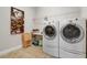 Laundry room with washer, dryer, and folding table at 23402 Copperleaf Dr, Venice, FL 34293