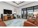 Spacious living area with sliding glass doors leading to patio at 23402 Copperleaf Dr, Venice, FL 34293