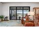Living room showcases a relaxing view, comfy seating, and natural light at 23402 Copperleaf Dr, Venice, FL 34293