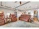 Relaxing living room with leather furniture and large windows at 23402 Copperleaf Dr, Venice, FL 34293