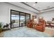 Relaxing living room with lake view and comfortable seating at 23402 Copperleaf Dr, Venice, FL 34293