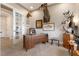 Bright office with wood desk, mounted animal heads and built-ins at 23402 Copperleaf Dr, Venice, FL 34293