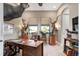 Spacious home office with large windows and hardwood desk at 23402 Copperleaf Dr, Venice, FL 34293