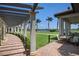 Pergola-covered walkway with golf course views at 23402 Copperleaf Dr, Venice, FL 34293