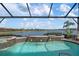 Relaxing pool and spa with a view of the lake at 23402 Copperleaf Dr, Venice, FL 34293