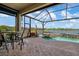 Inviting screened pool and spa with lake view at 23402 Copperleaf Dr, Venice, FL 34293