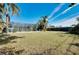 Large backyard with grassy area and fenced perimeter at 237 San Marco Dr, Venice, FL 34285