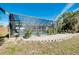 Landscaped backyard with pool and screened enclosure at 237 San Marco Dr, Venice, FL 34285