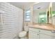 Clean bathroom with shower/tub combo, toilet, and a vanity with storage at 237 San Marco Dr, Venice, FL 34285