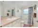 Bright bathroom with a tub, shower, and updated vanity at 237 San Marco Dr, Venice, FL 34285