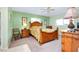 Bright bedroom with wood bed frame and tropical bedding at 237 San Marco Dr, Venice, FL 34285
