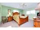 Guest bedroom with a wooden bed frame, ample closet space, and light colored walls at 237 San Marco Dr, Venice, FL 34285