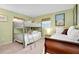 Bedroom with a bunk bed and a sleigh bed, ideal for guests or children at 237 San Marco Dr, Venice, FL 34285