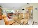 Bright dining area with glass-top table and wicker chairs at 237 San Marco Dr, Venice, FL 34285