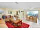 Open dining area with wicker furniture and view of pool at 237 San Marco Dr, Venice, FL 34285