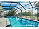 Large, refreshing pool with a screened enclosure at 237 San Marco Dr, Venice, FL 34285