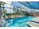Inviting, screened pool with a spacious deck at 237 San Marco Dr, Venice, FL 34285