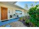 Charming front entry with wood door and small seating area at 237 San Marco Dr, Venice, FL 34285