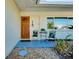 Inviting front porch with a small table and chairs, perfect for relaxing at 237 San Marco Dr, Venice, FL 34285