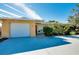 House exterior with attached garage and landscaped front yard at 237 San Marco Dr, Venice, FL 34285