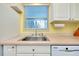Clean kitchen with stainless steel sink and white cabinets at 237 San Marco Dr, Venice, FL 34285