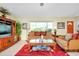Relaxing living room, featuring a large window and comfy seating at 237 San Marco Dr, Venice, FL 34285
