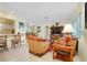 Open concept living room and kitchen with comfortable seating and a view into the kitchen at 237 San Marco Dr, Venice, FL 34285