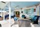 Covered patio with seating area and painted ceiling at 237 San Marco Dr, Venice, FL 34285
