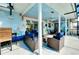 Covered patio with whimsical mural, seating, and pool access at 237 San Marco Dr, Venice, FL 34285