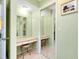 Built-in vanity with mirror and seating at 237 San Marco Dr, Venice, FL 34285